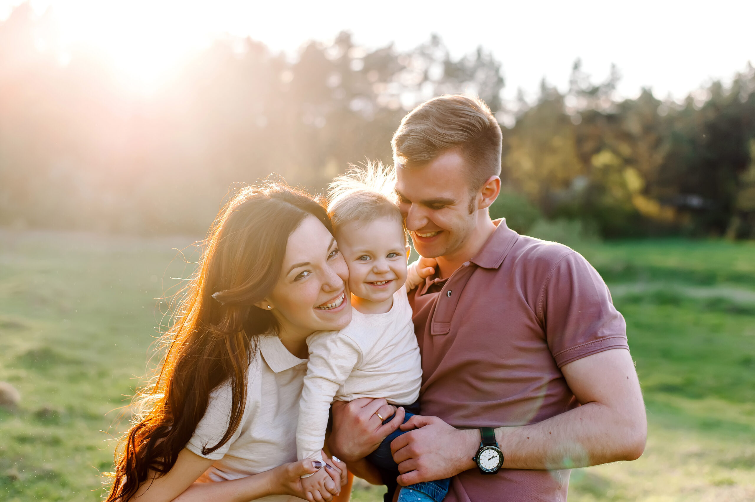 Couple smiling at their baby conceived with a gestational carrier | Ember Fertility Center, Orange County